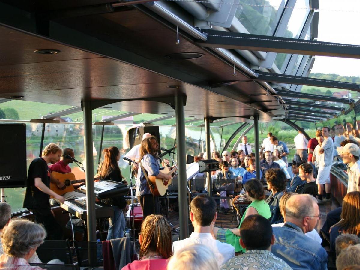 a group of people sitting in front of a crowd