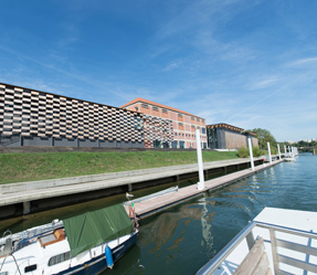 4 a boat is docked next to a body of water