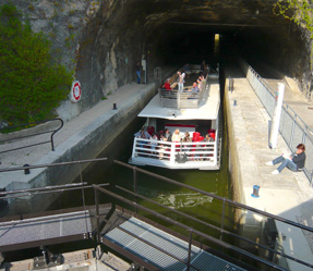 9 a boat filled with logs