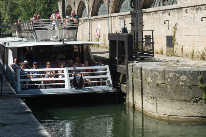 a boat sitting on top of a stone building