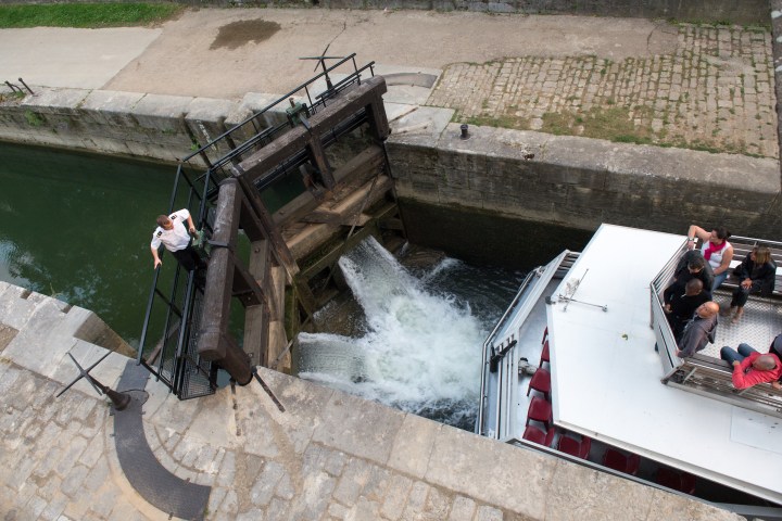a boat that is sitting on the side of a building