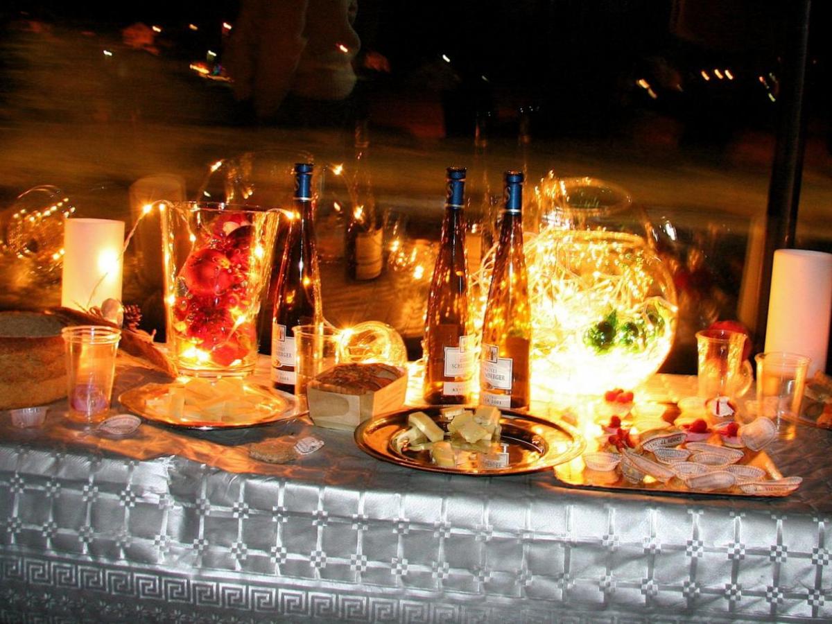 a group of people sitting at a table with wine glasses