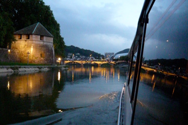 a boat is docked next to a body of water