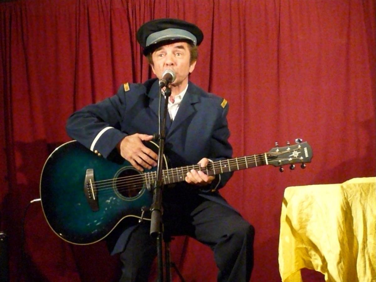 a man holding a guitar