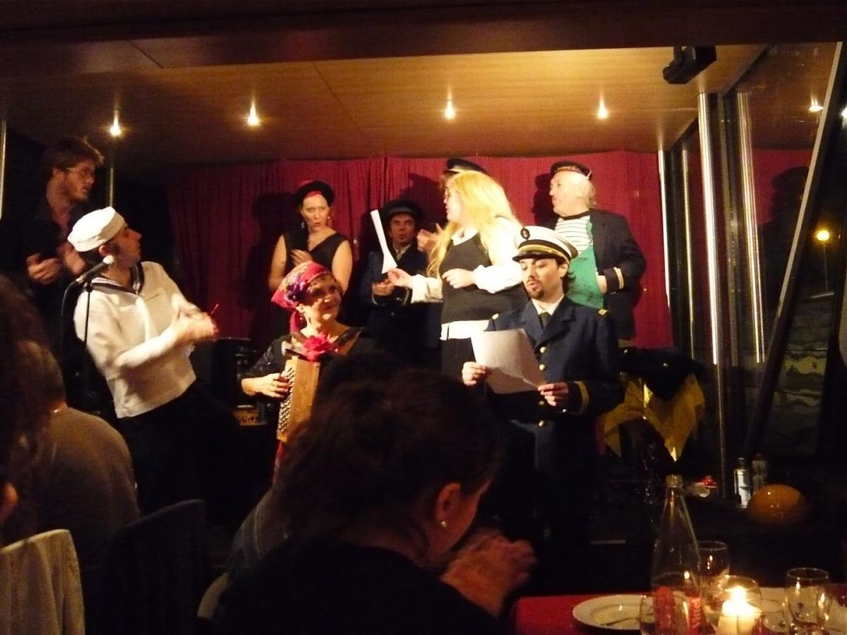 a group of people sitting at a table in a restaurant