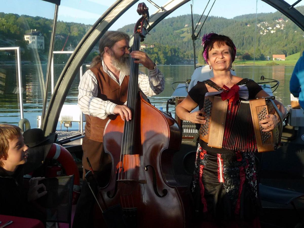 a group of people riding on the back of a boat