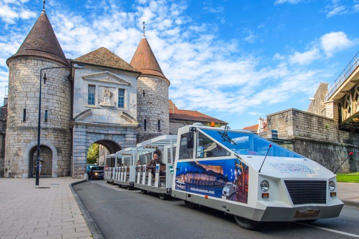 a truck is parked in front of a building