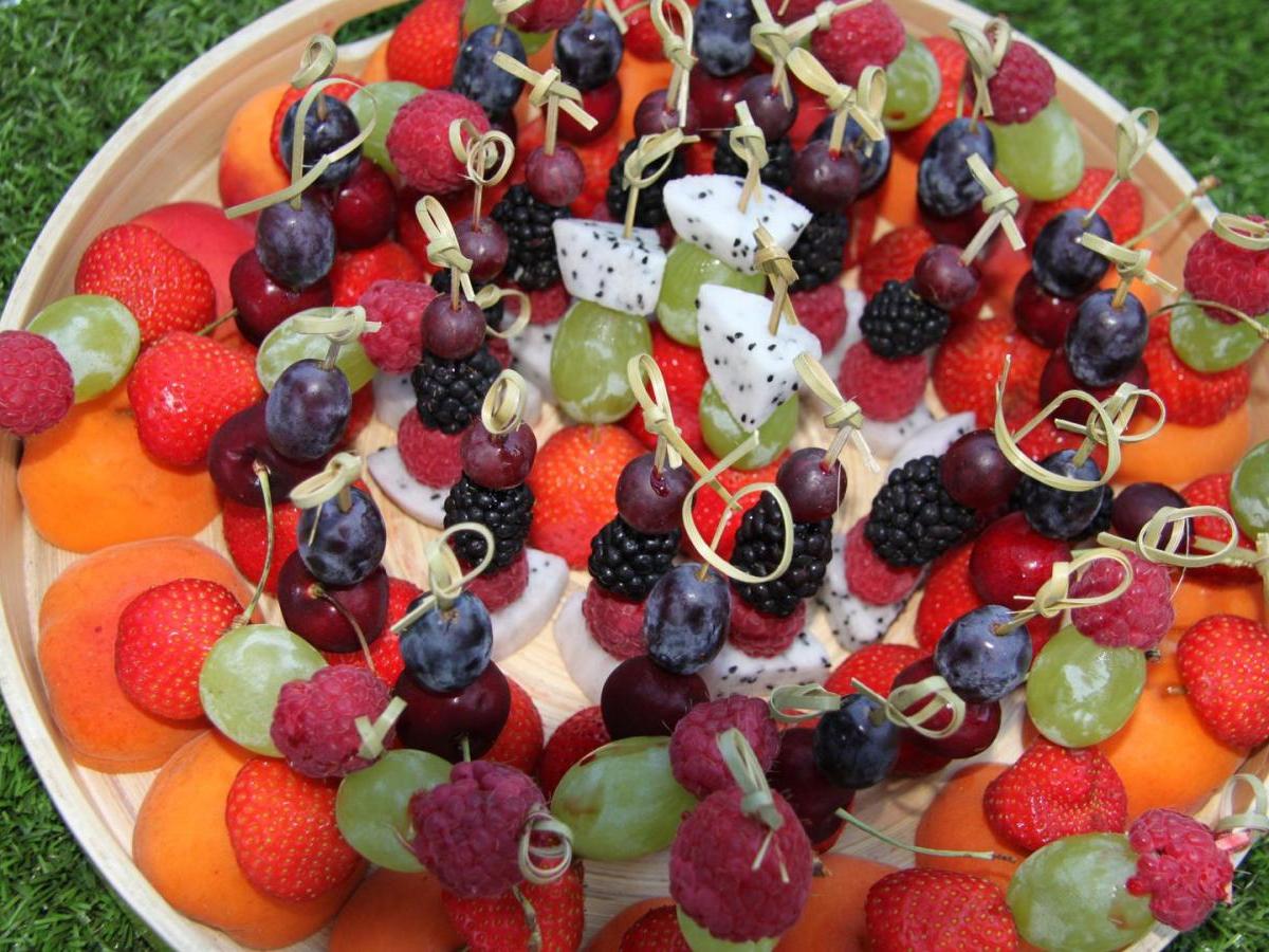 a cake with fruit on top of a table