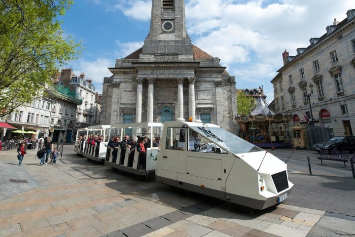 a group of people standing in front of a building