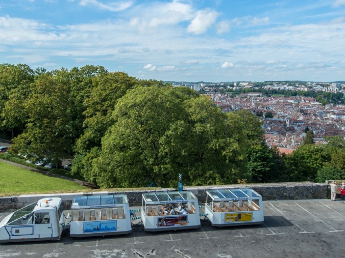 a train is parked on the side of a road