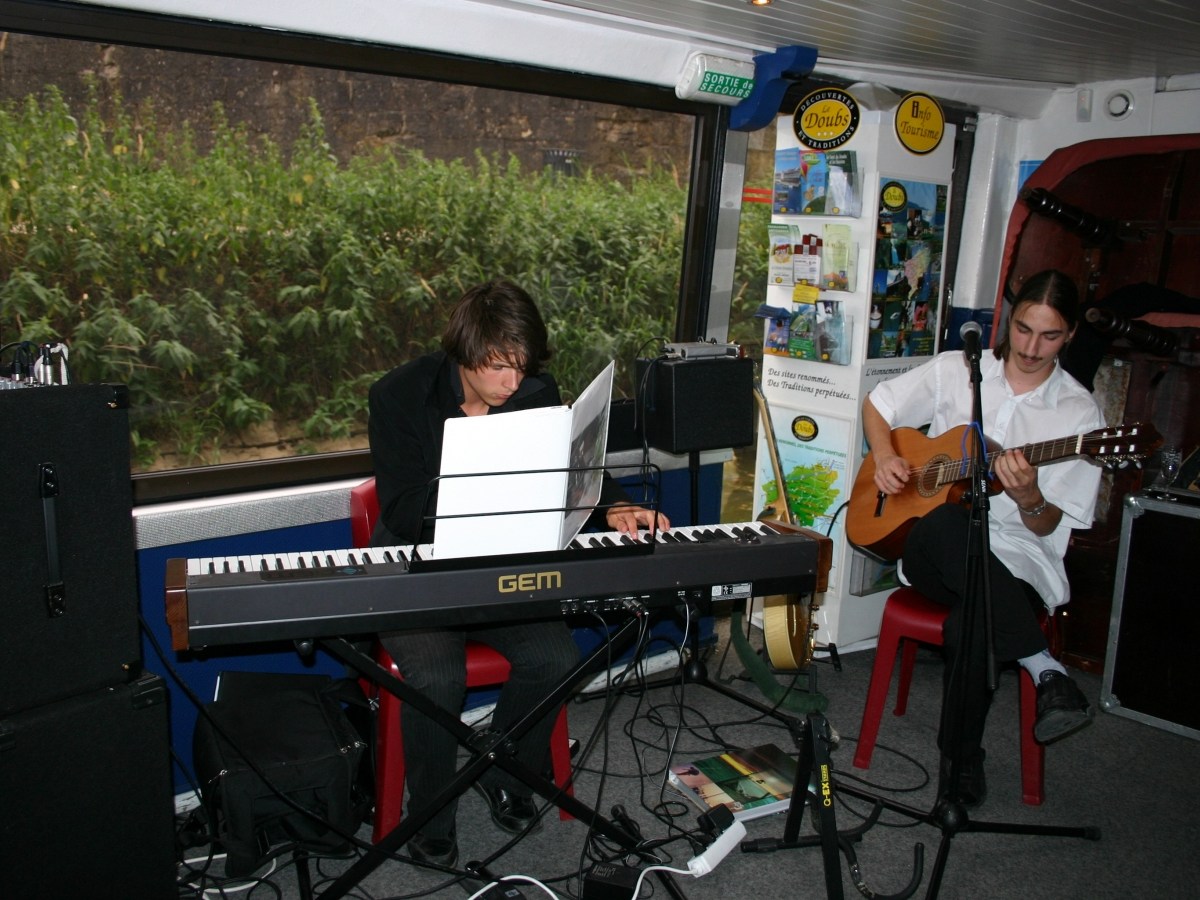 a man with a bicycle in front of a laptop