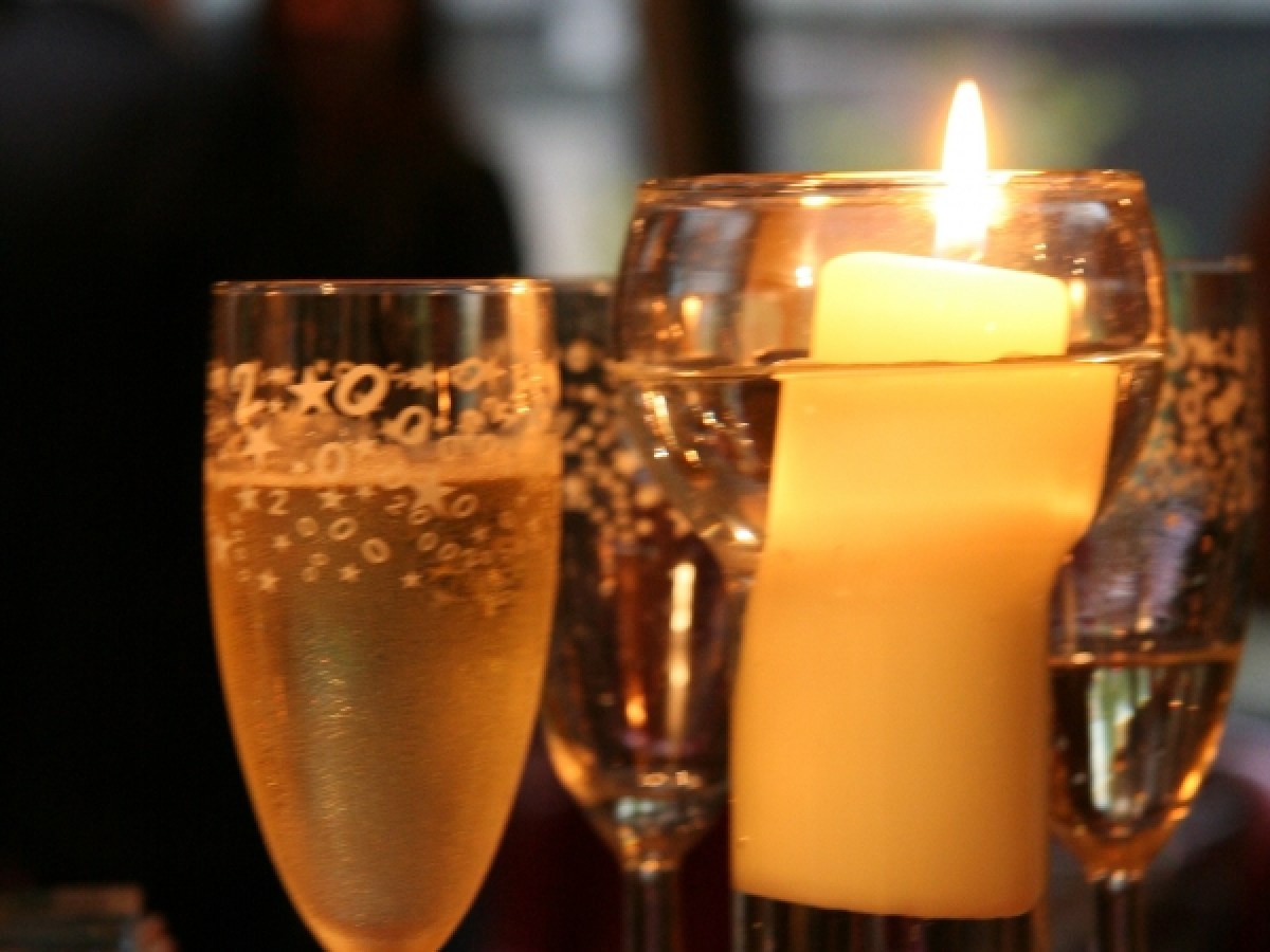 a close up of a wine glass on a table