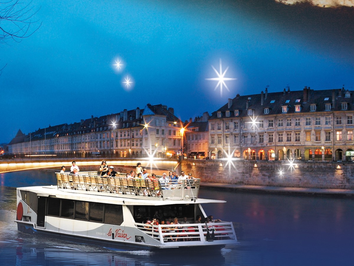 a boat is docked next to a body of water