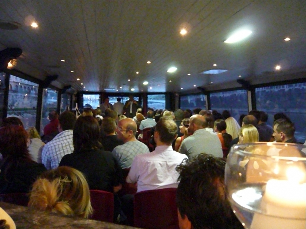 a group of people sitting at a bar