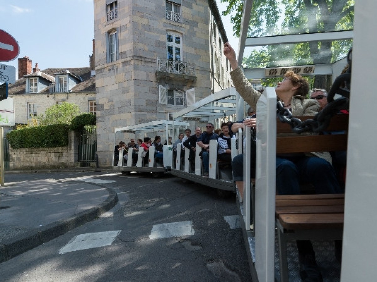 a group of people sitting at a bus stop