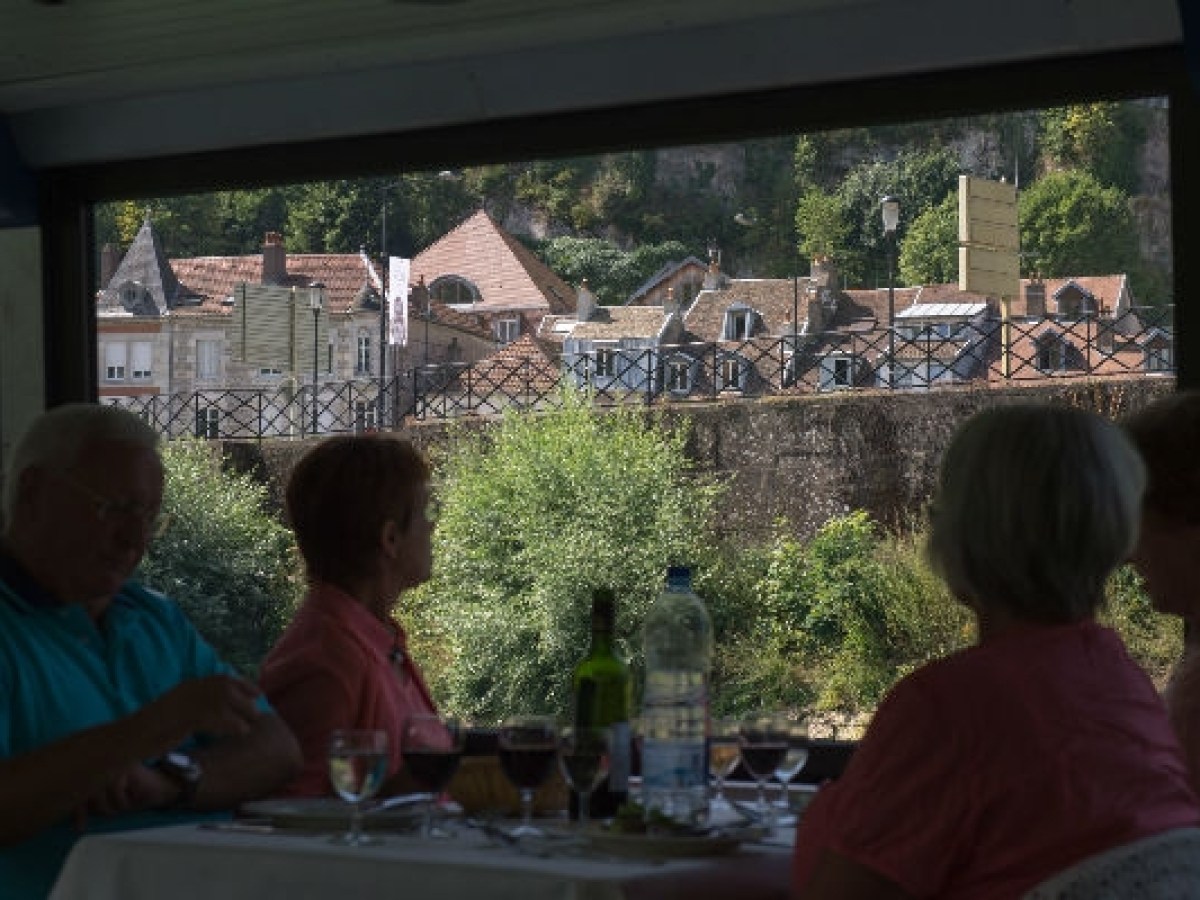 a group of people standing in front of a window